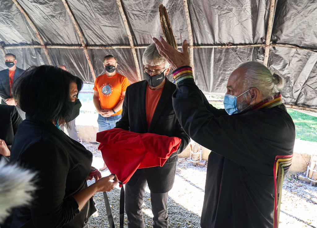 Blanket ceremony: ACU CEO, Kevin Sitka, passes the blanket