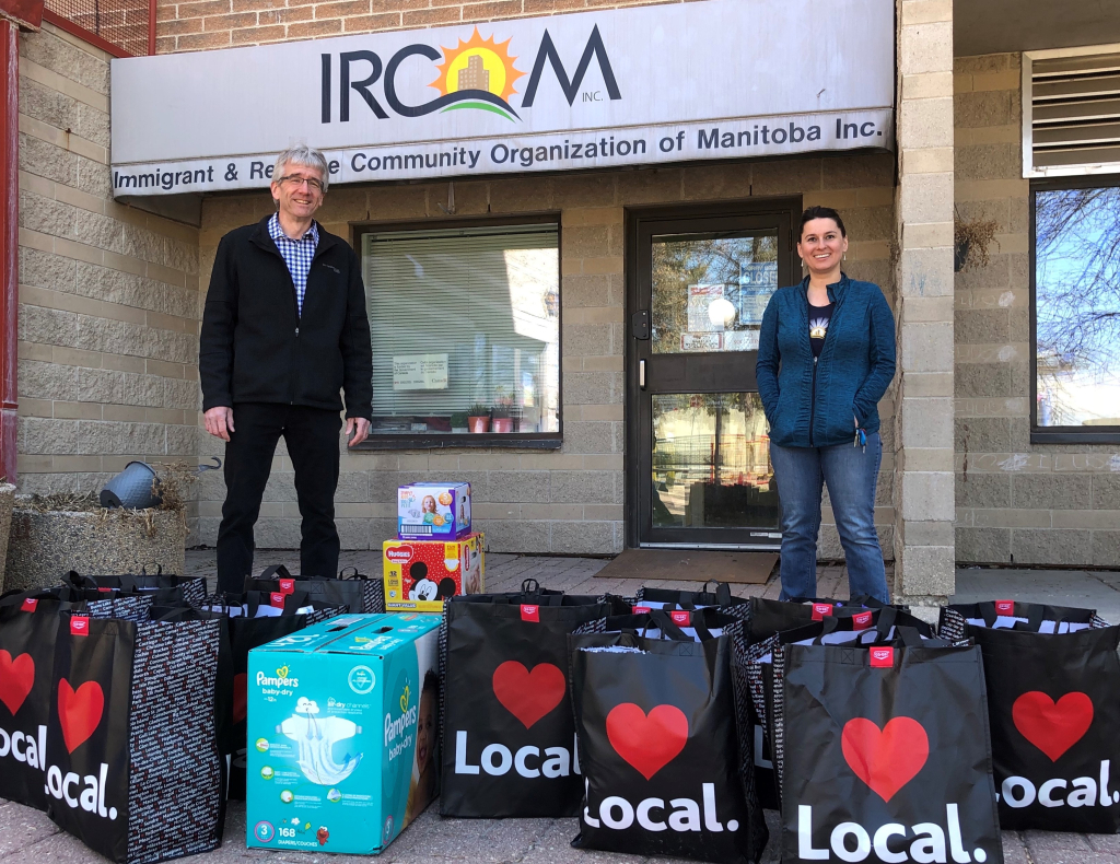 President and CEO Kevin Sitka, delivering ACU members' Community Response Drive donations to the Immigrant and Refugee Community Organization of Manitoba. 