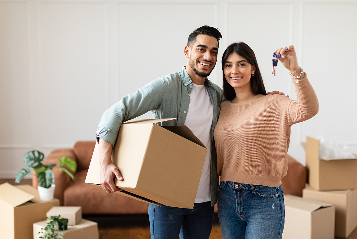 Saving for a down payment: Happy homeowners moving in