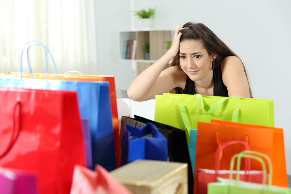 Women regretting buying too many gifts for the holidays
