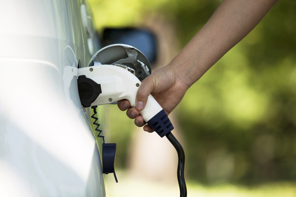 Photo of an EV charging a car