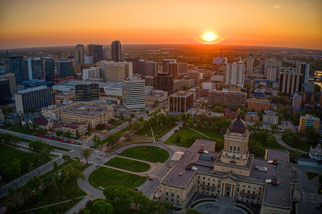 overhead view of downtown Winnipeg with a sunset in the background