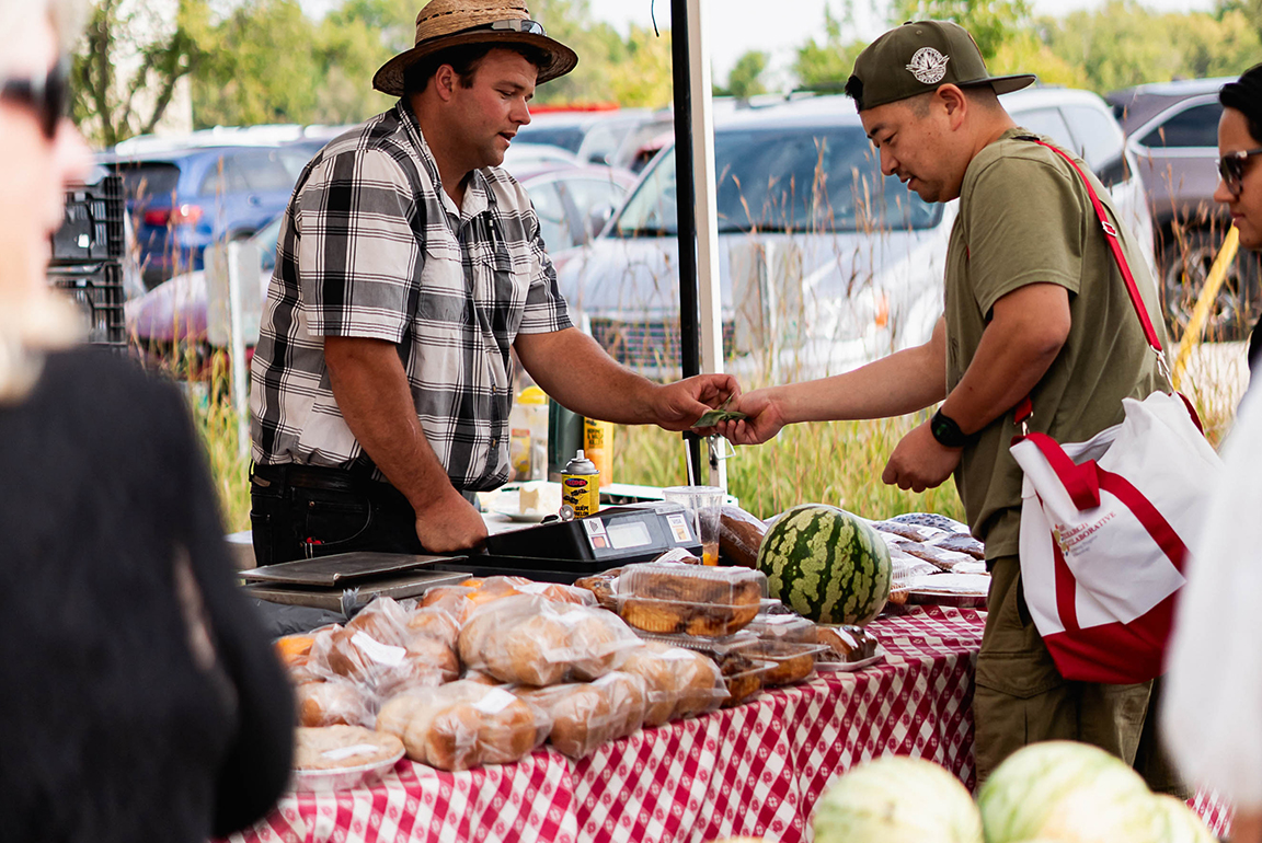 Direct Farm Manitoba shoppers at an outdoor stand