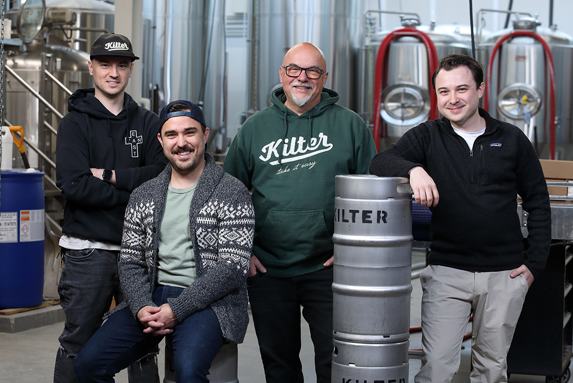 The founders of Kilter Brewing Co seen inside the Winnipeg-based brewery.